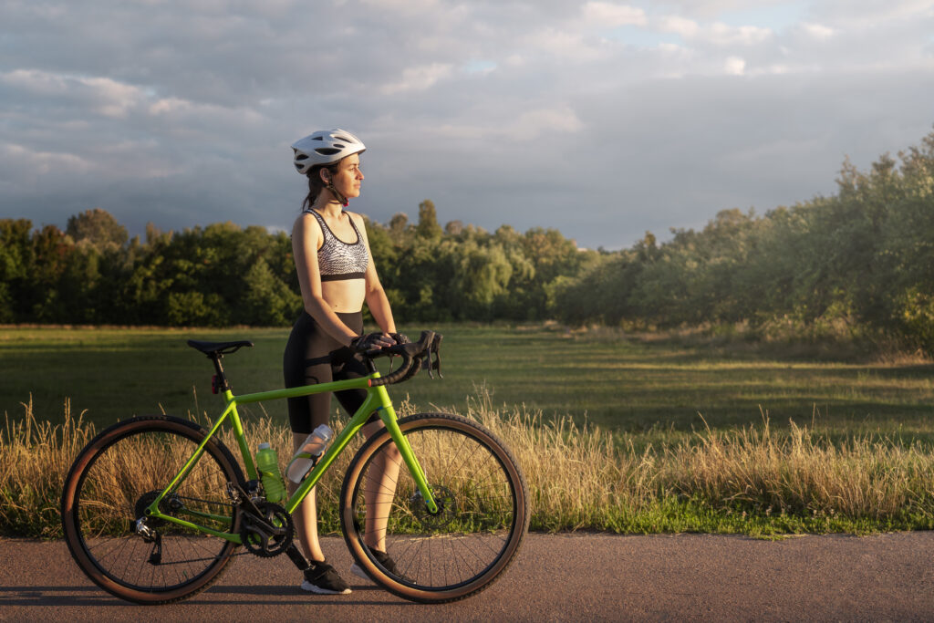 a woman cyclist looking forward to her journey with her cycle specially made for women's convenience and amazing built quality , same as offered at our cycle shop.